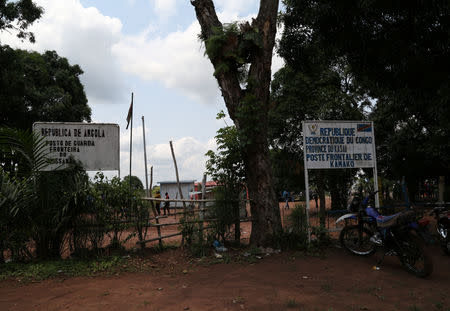 Signposts are seen at the border crossing of Kamako, Kasai province in the Democratic Republic of the Congo, October 13, 2018. REUTERS/Giulia Paravicini
