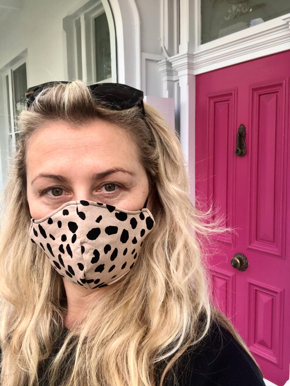 Dominica Graham is seen wearing a mask in a selfie taken outside of her oncologist's office after learning of her cancer diagnosis.