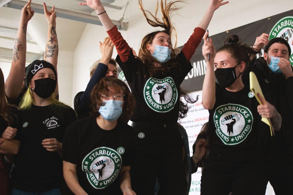 Starbucks employees and supporters react as votes are read during a viewing of their union election in Buffalo, N.Y., in December 2021.