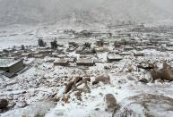 A general view shows the Saint Catherine's monastery in central Sinai, covered with snow during a very cold weather in Egypt, December 14, 2013. A powerful winter storm sweeping the eastern Mediterranean this week is causing mayhem across the region and inflicting extra hardships on Syrians convulsed in civil war and on refugees who have fled the fighting. The storm, named Alexa, is expected to last until Saturday, bringing more snow, rain and cold to swathes of Turkey, Syria, Lebanon, Jordan, Israel, the Palestinian territories and Egypt. Picture taken December 14, 2013. REUTERS/Stringer (EGYPT - Tags: RELIGION ENVIRONMENT)