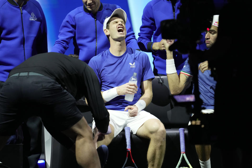 Team Europe's Andy Murray reacts as he receives medical treatment during a match against Team World's Jack Sock and Felix Auger-Aliassime on final day of the Laver Cup tennis tournament at the O2 in London, Sunday, Sept. 25, 2022. (AP Photo/Kin Cheung)