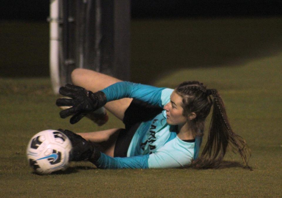Bartram Trail goalkeeper Lily Holden dives to stop a shot in warm-ups before a Nov. 29 game against Creekside. The junior has committed to Florida.