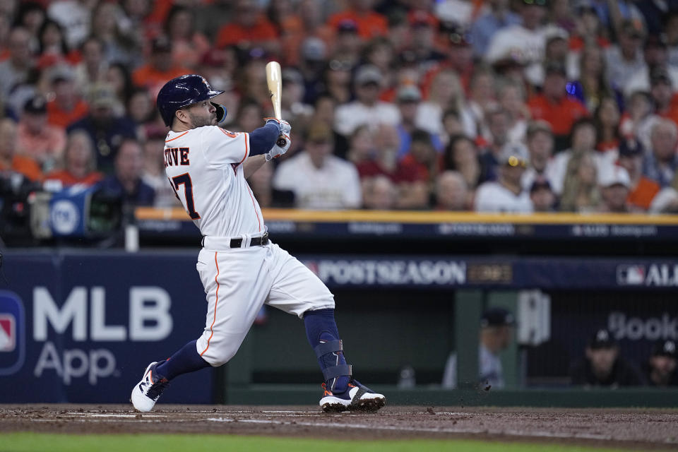Houston Astros' Jose Altuve connects for a solo home run during the first inning in Game 1 of an American League Division Series baseball game against the Minnesota Twins, Saturday, Oct. 7, 2023, in Houston. (AP Photo/Kevin M. Cox)