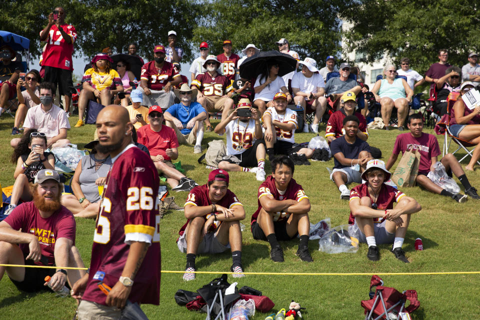 Washington Football Team fans watch drills during NFL football practice in Richmond, Va., Wednesday, July 28, 2021. (AP Photo/Ryan M. Kelly)