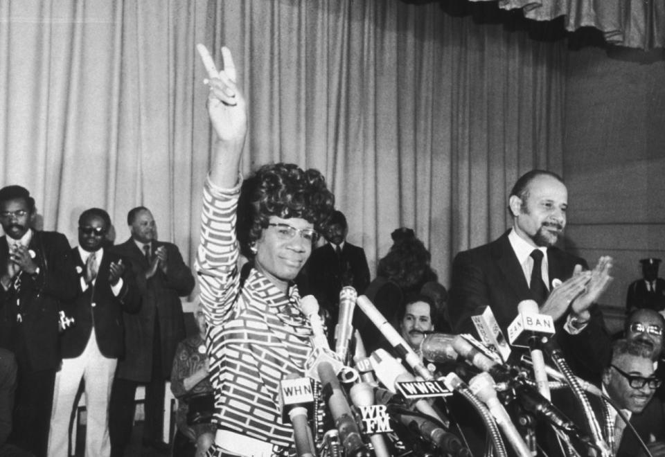 US Representative Shirley Chisholm of Brooklyn announces her entry for Democratic nomination for the presidency, at the Concord Baptist Church in Brooklyn, New York. Manhattan borough president Percy Sutton applauds at right [Photo by Don Hogan Charles/New York Times Co./Getty Images].