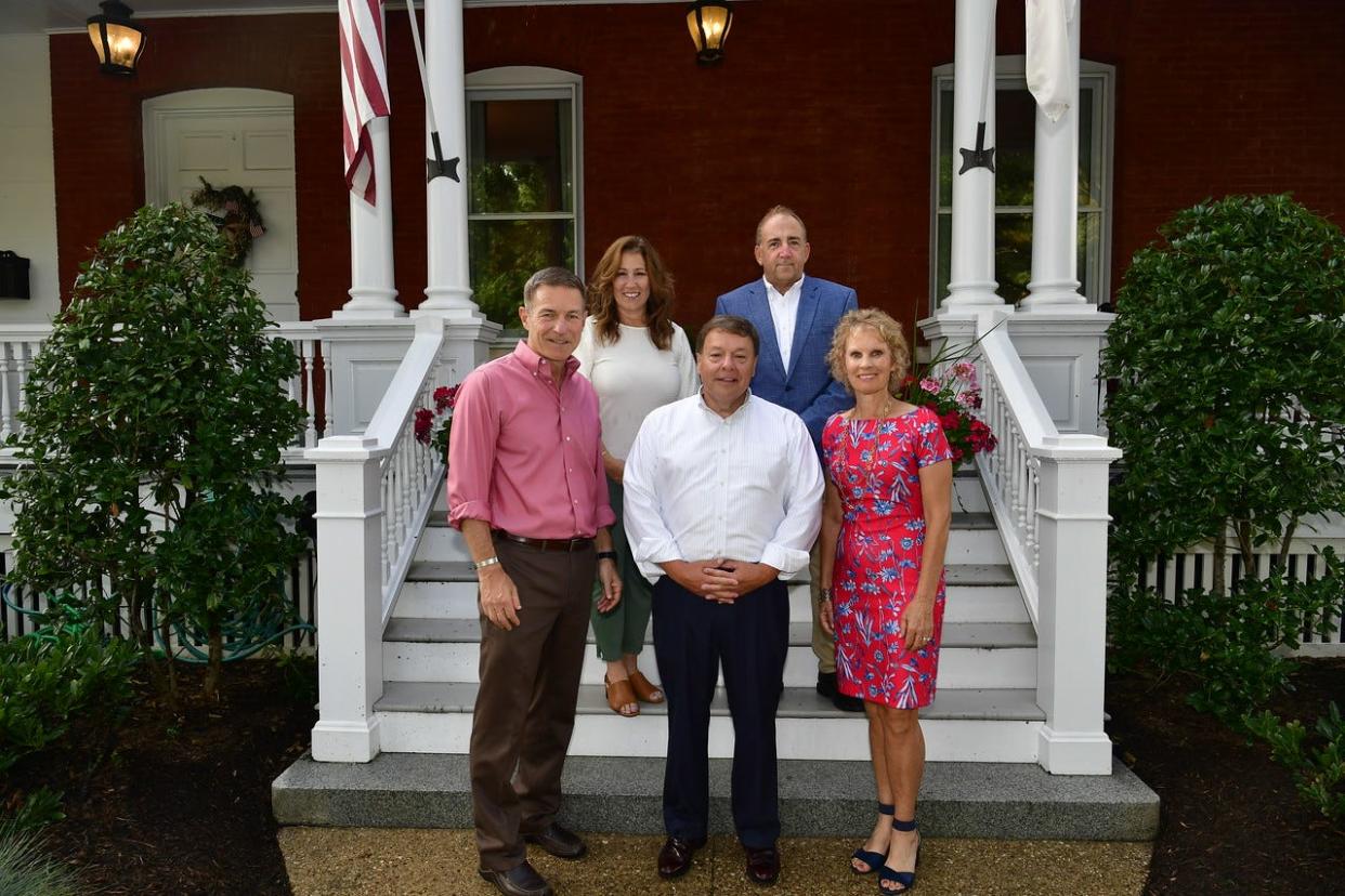 Gen. James McConville, left, and his wife, Maria, right, are shown at their Washington, D.C., home with Mayor Thomas Koch, front center; Lisa Aimola, back left; and Mark Carey, back right.