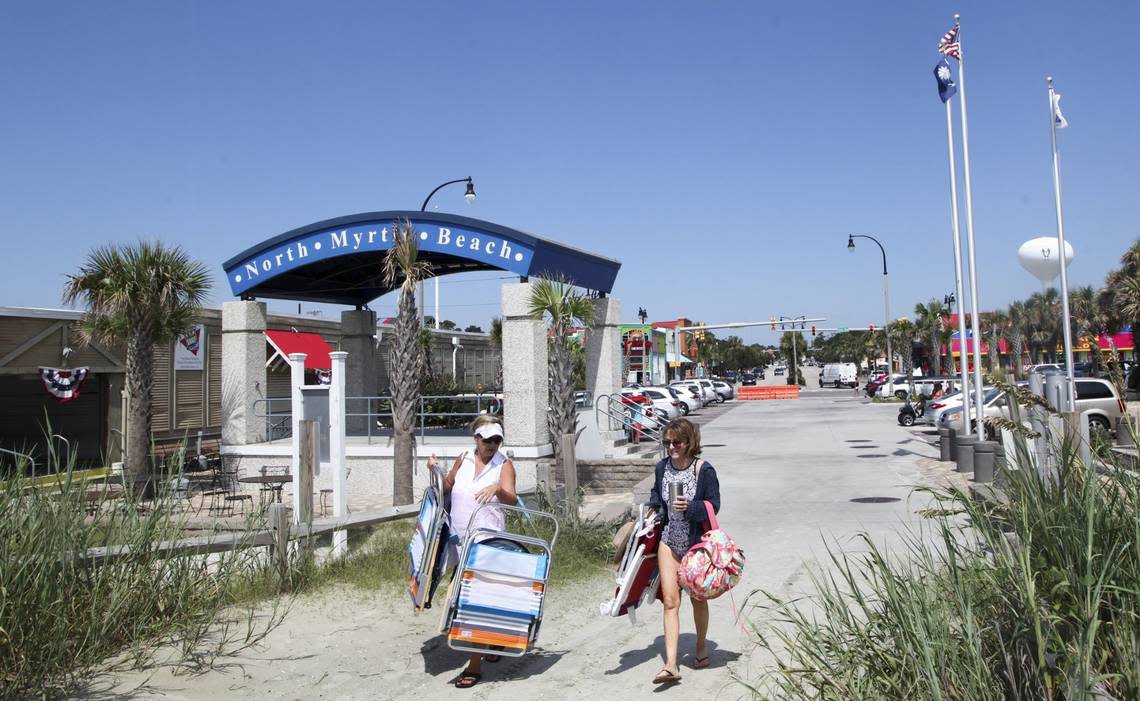 Beachgoers arrive at the North Myrtle Beach Pavilion, one of the 57 accessible beach entrances on the Grand Strand. File photo.