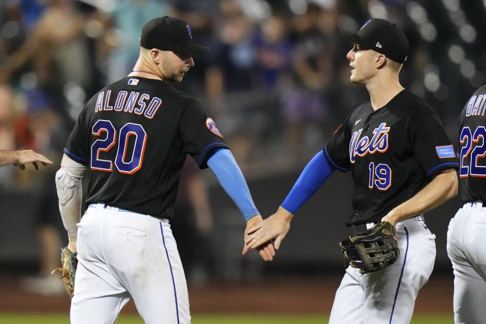 New York Mets' Pete Alonso (20) celebrates with Mark Canha (19) after the team's 5-1 win in a baseball game against the Washington Nationals on Friday, July 28, 2023, in New York. (AP Photo/Frank Franklin II)