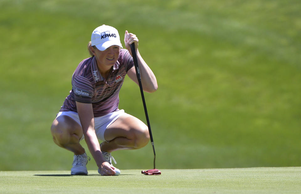 Stacy Lewis lines up a putt on the first green during the final round of the Kia Classic LPGA golf tournament Sunday, March 31, 2019, in Carlsbad, Calif. (AP Photo/Orlando Ramirez)