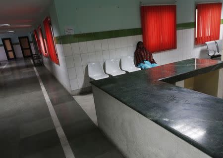 A patient sits outside a doctor's room inside Janakpuri Super Speciality Hospital in New Delhi January 19, 2015. REUTERS/Adnan Abidi
