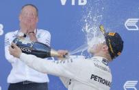 Formula One - F1 - Russian Grand Prix - Sochi, Russia - 30/04/17 - Winner and Mercedes Formula One driver Valtteri Bottas of Finland sprays champagne on the podium. REUTERS/Maxim Shemetov