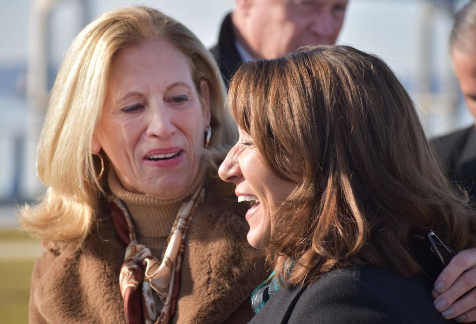 Lt. Gov. Karyn Polito and state Rep. Carole Fiola celebrate the groundbreaking for the Route 79 and Davol Street Corridor Improvement Project at the City Pier in Fall River Wednesday, Dec. 21.