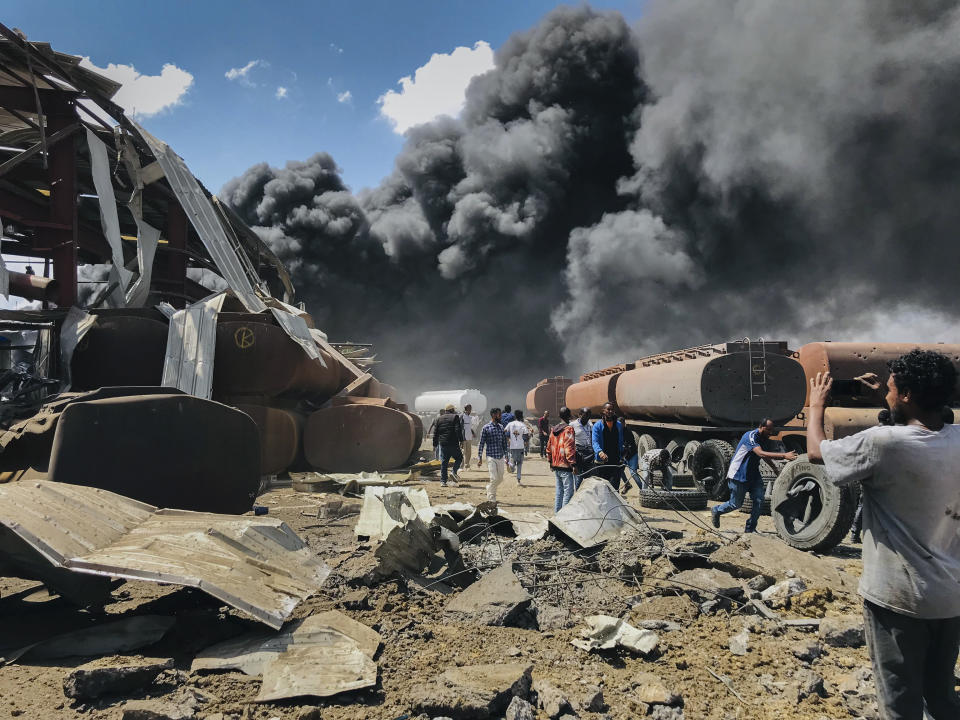 FILE - In this Wednesday, Oct. 20, 2021 file photo, smoke from fires billows at the scene of an airstrike in Mekele, the capital of the Tigray region of northern Ethiopia Wednesday, Oct. 20, 2021. Aid workers say Ethiopian military airstrikes have forced a United Nations humanitarian flight to abandon its landing in the capital of the country’s Tigray region. A government spokesman confirms that authorities had been aware of the inbound flight. The development appears to be a sharp escalation in the intimidation tactics that authorities have used against aid workers amid the intensifying, year-long Tigray war. (AP Photo, File)