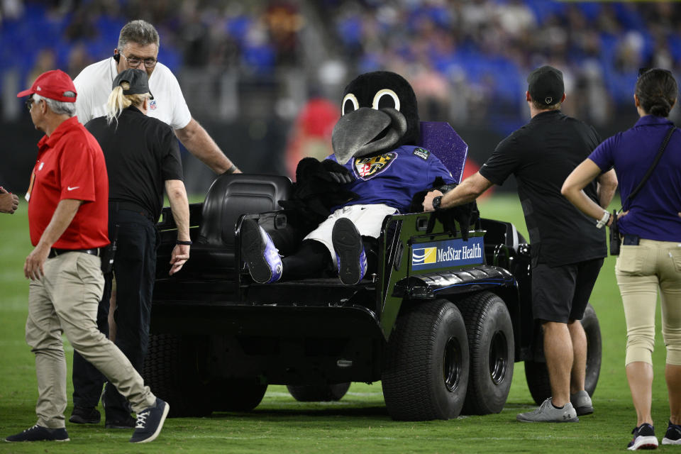 Poe, the Baltimore Ravens' mascot, sits on a medical cart during halftime of a preseason NFL football game between the Ravens and the Washington Commanders, Saturday, Aug. 27, 2022, in Baltimore. (AP Photo/Nick Wass)