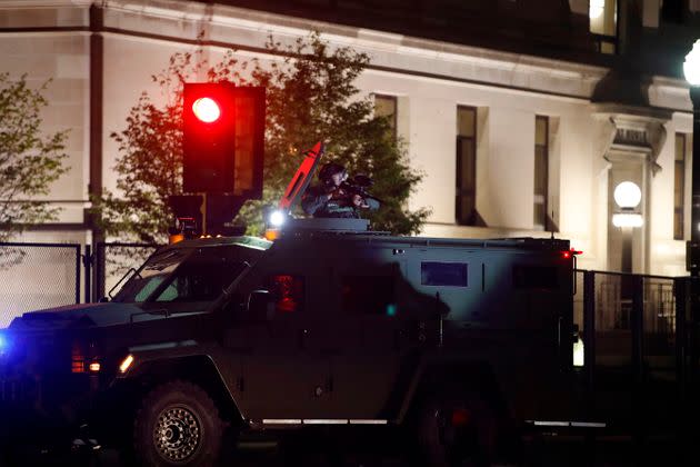 A member of the sheriff's department aims an anti-riot weapon from an armored vehicle during demonstrations against the police shooting of Jacob Blake in Kenosha, Wisconsin, on Aug. 25, 2020. (Photo: Kamil Krzacynski via Getty Images)