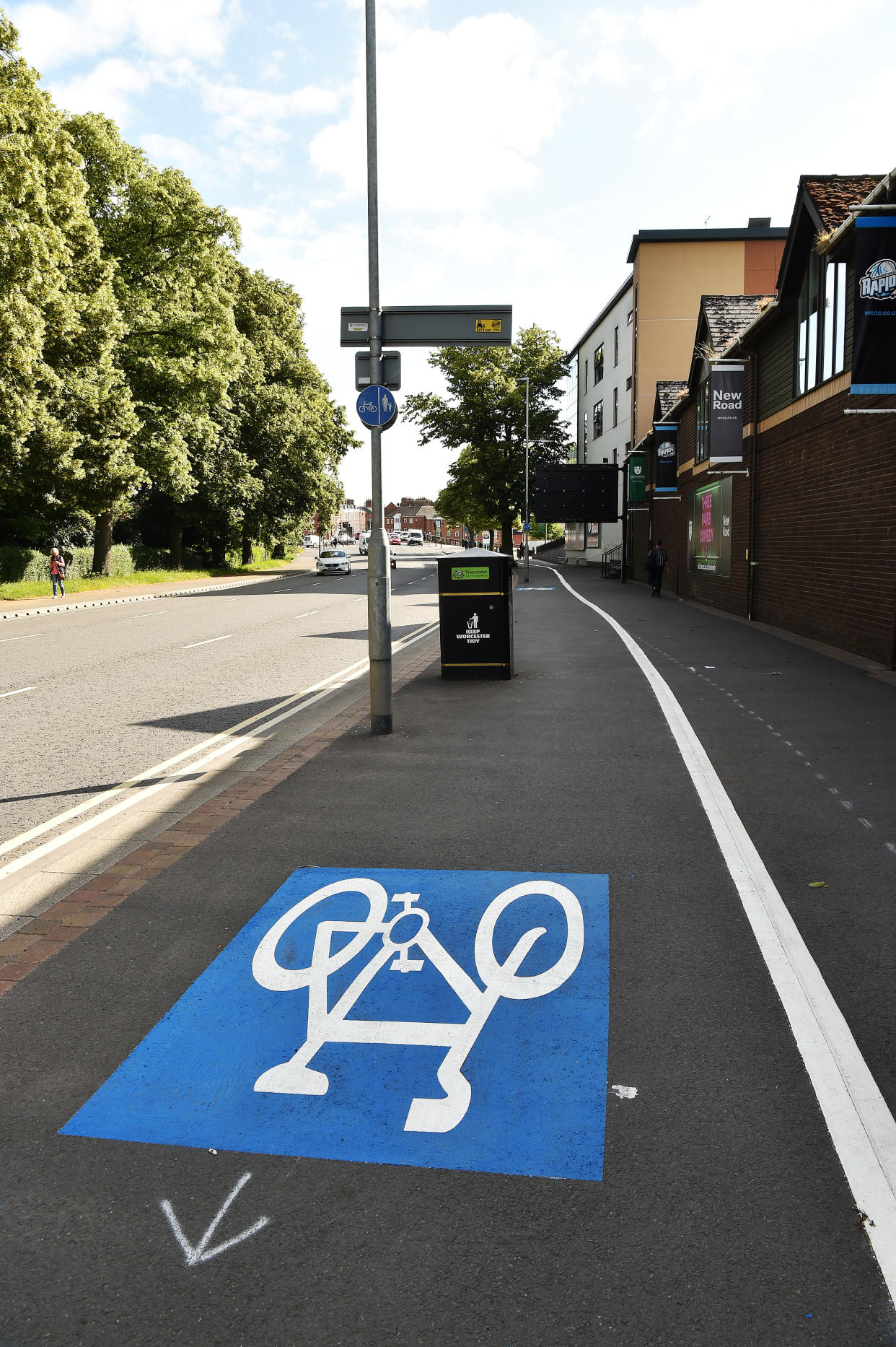 New cycle lane along New Road in Worcester from the city centre to St John's alongside Worcestershire Cricket Ground has various obstacles to navigate including a speed camera, bins and trees, all in the way of the route.  See SWNS story SWMDcycle.  June 21, 2022.  A cycle lane that is littered with obstacles including a speed camera, rubbish bins, trees and lampposts has been branded “insane”.  The barmy bike route in Worcester forces cyclists to zig-zag around numerous hazards.  On one stretch which is next to a busy main road, cyclists have to negotiate a speed camera and a lamppost which is blocking the lane.  The cycle lanes, which stretch 20 miles through Worcester, are part of a multi-million project aimed at encouraging people to cycle more.  Worcestershire County Council has installed a new segregated cycle lane along the busy New Road in Worcester as part of a pilot scheme.  But cyclists blasted the lane, saying it is “more dangerous than cycling on the road”. 