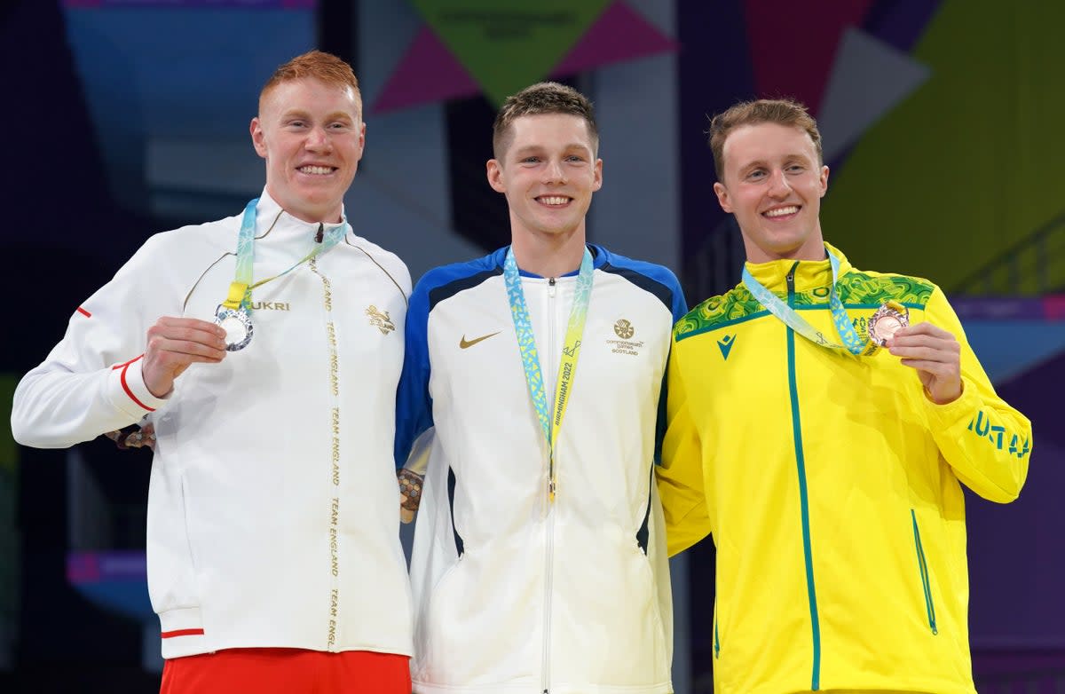 Duncan Scott, centre, claimed gold in the men’s 200m freestyle with victory over Tom Dean, left (David Davies/PA) (PA Wire)