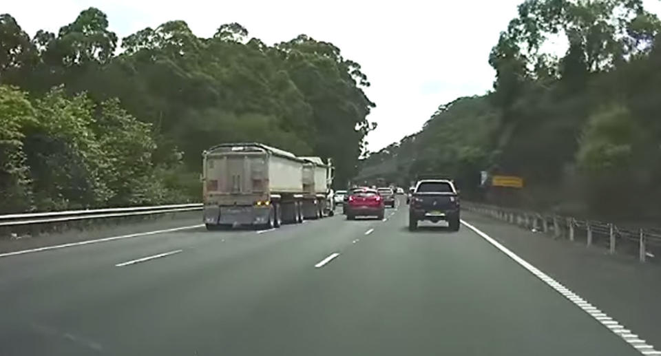 The truck then begins to move into the middle lane. Source: Facebook/ Dash Cam Owners Australia