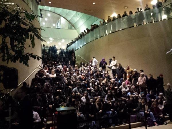 Students at NYU Kimmel center hold a vigil for the three Chapel Hill shooting victims on Wednesday, Feb. 11, 2015. 