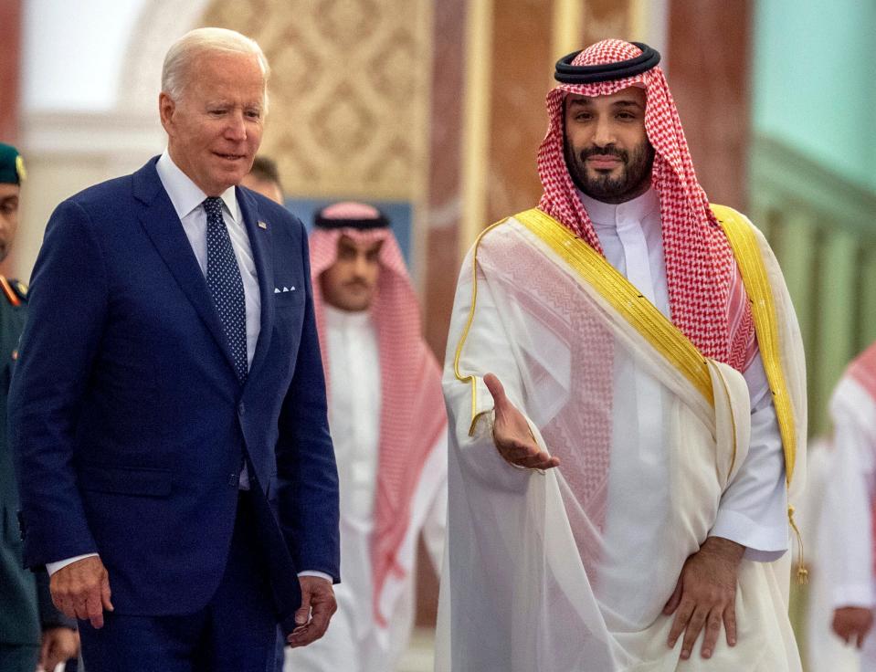 In this photo released by the Saudi Royal Palace, Saudi Crown Prince Mohammed bin Salman, right, welcomes President Joe Biden upon his arrival at Al-Salam palace in Jeddah, Saudi Arabia, Friday, July 15, 2022. (Bandar Aljaloud/Saudi Royal Palace via AP) ORG XMIT: AMR102