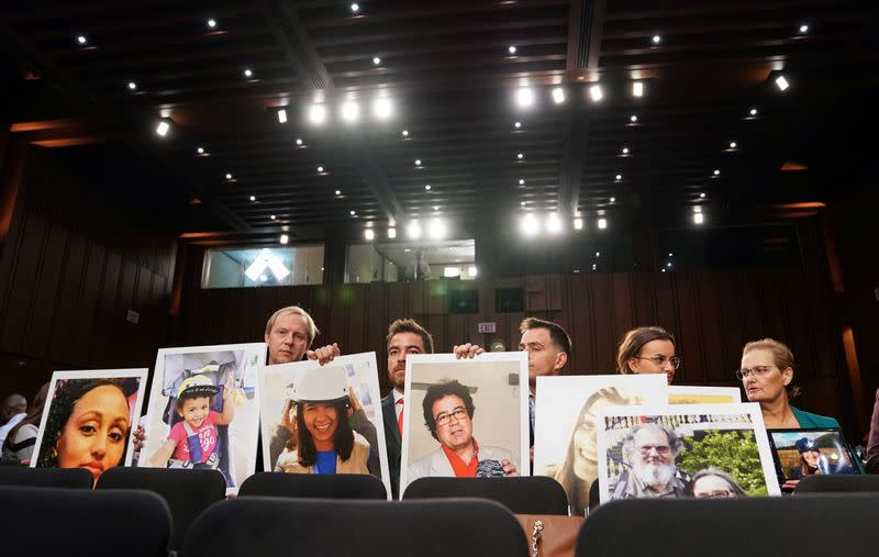 FILE PHOTO: Family members attend as Boeing's Muilenburg testifies before Senate Commerce, Science and Transportation hearing on grounded 737 MAX on Capitol Hill in Washington