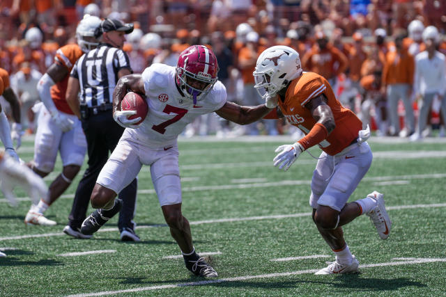 AUSTIN, TX - SEPTEMBER 10: Alabama Crimson Tide wide receiver Ja'Corey Brooks (7) stiff arms Texas Longhorns defensive back Anthony Cook (11) during the game between the Alabama Crimson Tide and the Texas Longhorns on September 10, 2022, at Darrell K Royal-Texas Memorial Stadium in Austin, Texas.  (Photo by Daniel Dunn/Icon Sportswire via Getty Images)
