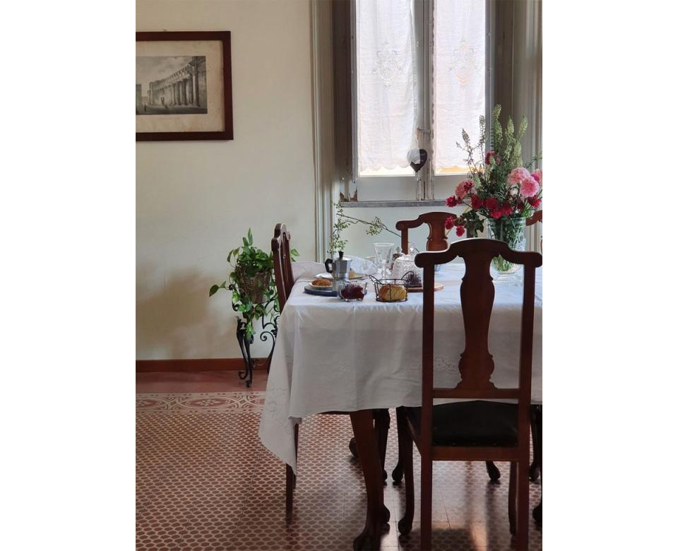 Original tile floors, cheery textiles and bold floral wallpapers rub along comfortably at this B&B (L'Olivella)