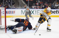 Nashville Predators' Matt Duchene (95) is stopped by Edmonton Oilers' goalie Mikko Koskinen (19) during shootout NHL hockey game action in Edmonton, Alberta, Thursday, Jan. 27, 2022. (Jason Franson/The Canadian Press via AP)