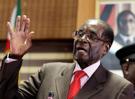 Zimbabwe's President Robert Mugabe gestures during his 93rd birthday celebrations in Harare, Zimbabwe, February 21, 2017. REUTERS/Philimon Bulawayo