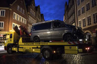 <p>A damaged van sits on the platform of a truck in Muenster, western Germany, Sunday, April 8, 2018 after the van crashed into people drinking outside a popular bar on Saturday afternoon on April 7, 2018. (Photo: Marius Becker/dpa via AP) </p>