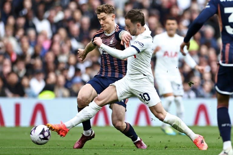 Pushing for the top: Tottenham's <a class="link " href="https://sports.yahoo.com/soccer/players/389525/" data-i13n="sec:content-canvas;subsec:anchor_text;elm:context_link" data-ylk="slk:James Maddison;sec:content-canvas;subsec:anchor_text;elm:context_link;itc:0">James Maddison</a> (R) in action against <a class="link " href="https://sports.yahoo.com/soccer/teams/nottingham/" data-i13n="sec:content-canvas;subsec:anchor_text;elm:context_link" data-ylk="slk:Nottingham Forest;sec:content-canvas;subsec:anchor_text;elm:context_link;itc:0">Nottingham Forest</a>'s <a class="link " href="https://sports.yahoo.com/soccer/players/890235/" data-i13n="sec:content-canvas;subsec:anchor_text;elm:context_link" data-ylk="slk:Ryan Yates;sec:content-canvas;subsec:anchor_text;elm:context_link;itc:0">Ryan Yates</a> (L) (HENRY NICHOLLS)