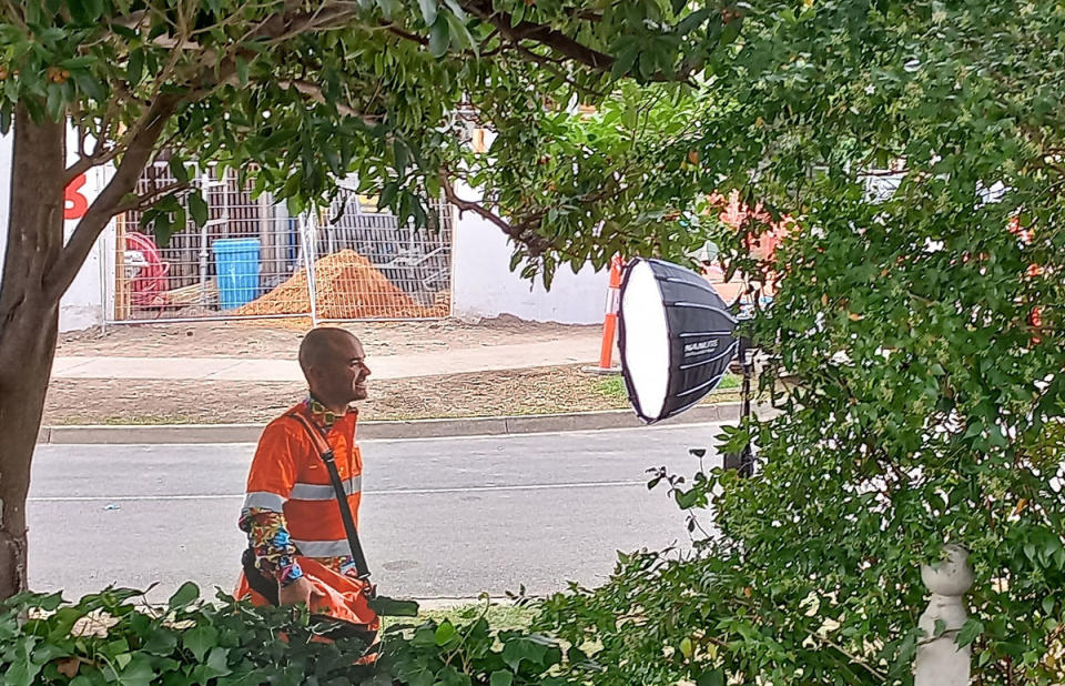 Tom getting a photo taken outside The Block