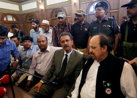 Waseem Akhtar (front row, 2nd R), mayor nominee of Muttahida Qaumi Movement (MQM) political party, waits with others before casting his ballot for mayor at the halls of the Municipal Corporation Building in Karachi, Pakistan, August 24, 2016. REUTERS/Akhtar Soomro?