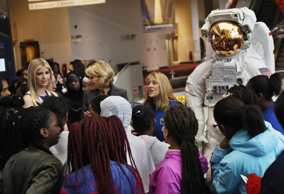 Ivanka Trump, left, Education Secretary Betsy DeVos, center, listens as NASA Astronaut Kay Hire speaks to female students at the Smithsonian's National Air and Space Museum in Washington, Tuesday, March 28, 2017, to celebrate Women's History Month. (AP Photo/Manuel Balce Ceneta)