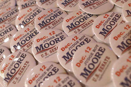 Buttons in support of Republican candidate for U.S. Senate Judge Roy Moore are seen before a campaign rally in Fairhope, Alabama, U.S., December 5, 2017. REUTERS/Jonathan Bachman