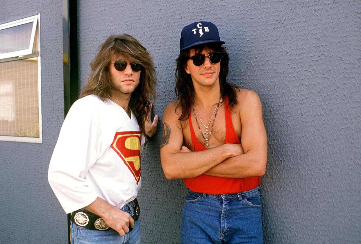 Jon Bon Jovi And Richie Sambora, with long hair and wearing shades, circa 1983.