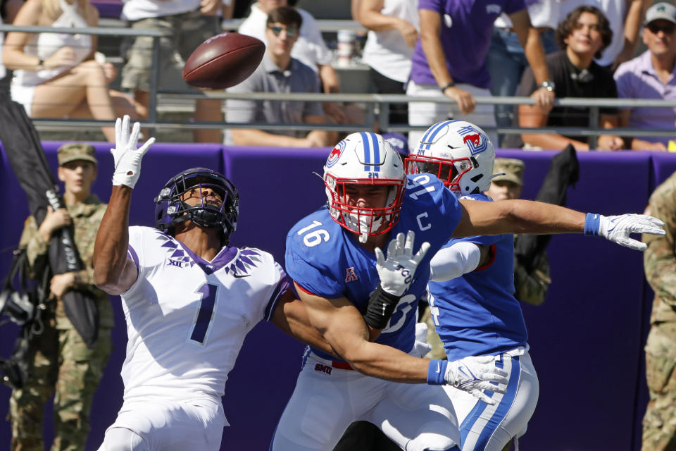 SMU linebacker Trevor Denbow (16) is called for pass interference against TCU wide receiver Quentin Johnston (1) during the first half of an NCAA football game in Fort Worth, Texas, Saturday, Sept. 25, 2021. (AP Photo/Michael Ainsworth)