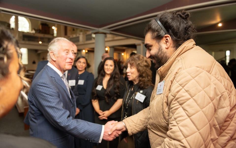 Pav Soor, right, told the Prince how he turned his life around after being rejected for several jobs - The Prince’s Trust /PA Wire