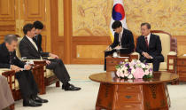 South Korean President Moon Jae-in, right, talks with U.S. Defense Secretary Mark Esper, second from left, during a meeting at the presidential Blue House in Seoul, South Korea, Friday, Nov. 15, 2019. (Lee Jin-wook/Yonhap via AP)