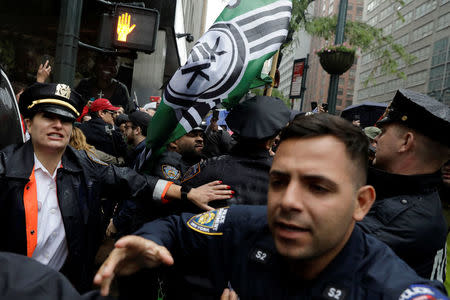 New York City Police officers (NYPD) and demonstrators clash during a protest against CUNY commencement speaker Linda Sarsour, former executive director of the Arab American Association, in New York City, U.S., May 25, 2017. REUTERS/Lucas Jackson