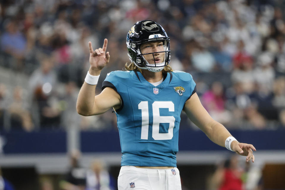 Jacksonville Jaguars quarterback Trevor Lawrence (16) gestures during the first half of an NFL preseason football game against the Dallas Cowboys, Saturday, Aug. 12, 2023, in Arlington, Texas. (AP Photo/Michael Ainsworth)