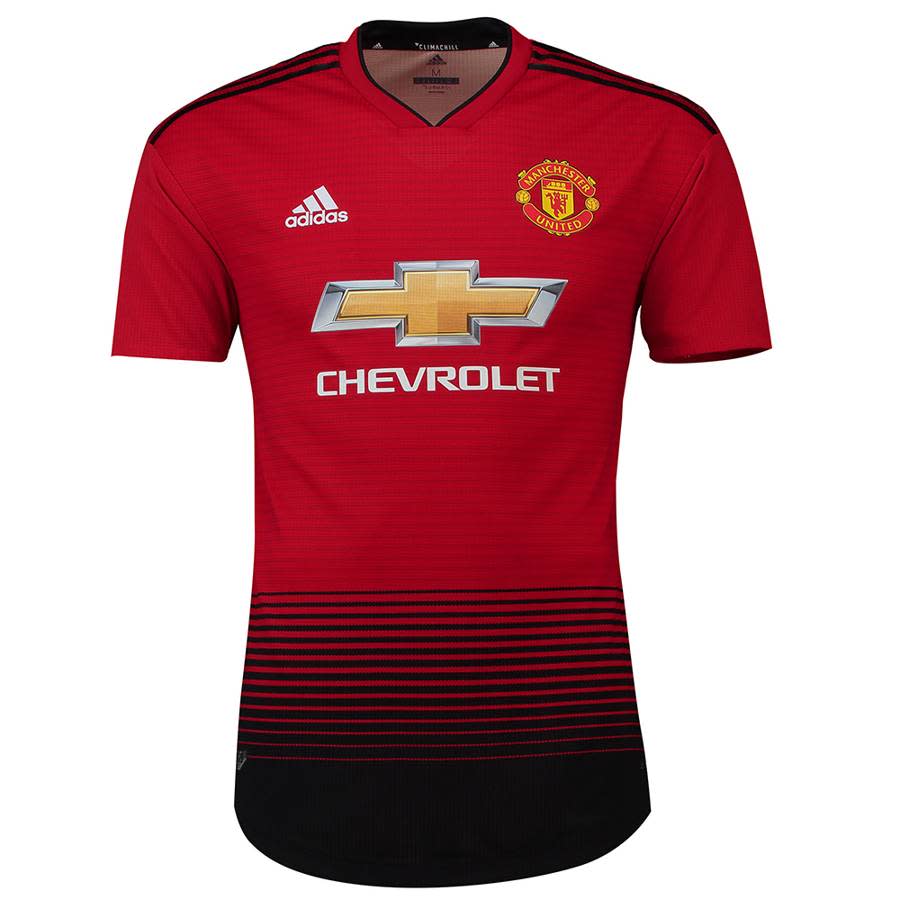 <p>United have introduced a run of black stripes that fade into a solid block. </p>