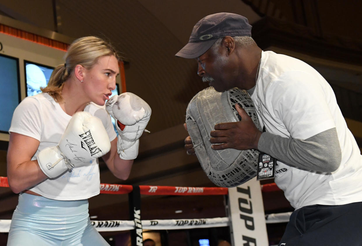 Boxer Mikaela Mayer (L) works out with her coach Al Mitchell at MGM Grand Hotel & Casino on June 11, 2019 in Las Vegas, Nevada. Mayer will face Lizbeth Crespo in a super featherweight bout on June 15 at MGM Grand Garden Arena in Las Vegas.  (Photo by Ethan Miller/Getty Images)