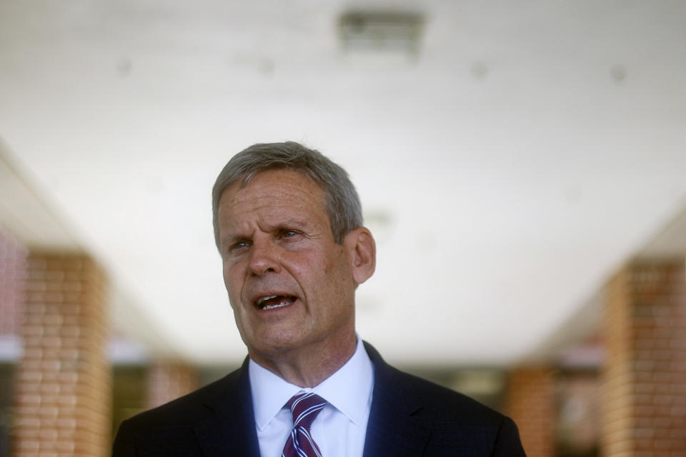 Gov. Bill Lee speaks to local media at the front of McConnell Elementary School on Wednesday, Aug. 11, 2021 in Hixson, Tenn., after presenting the school with the Governor's Civic Seal, an award given to schools and districts that prioritize teaching the nation's history and core values, according to Lee's office. Mothers of two children with serious illnesses asked a federal judge Monday, Aug. 30, 2021, to block enforcement of Lee's order allowing parents to opt out of coronavirus-related mask requirements in schools, arguing that it endangers kids with health conditions and hurts their ability to attend in-person classes. (Troy Stolt/Chattanooga Times Free Press via AP, File)