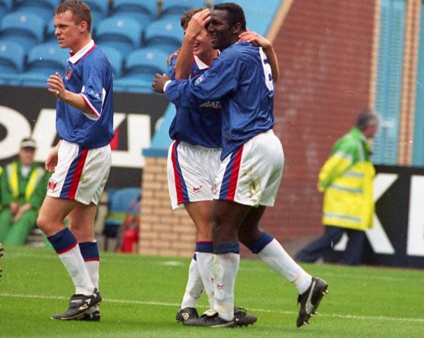 News and Star: Pounewatchy congratulates Matt Jansen on a goal in the 1997/8 campaign