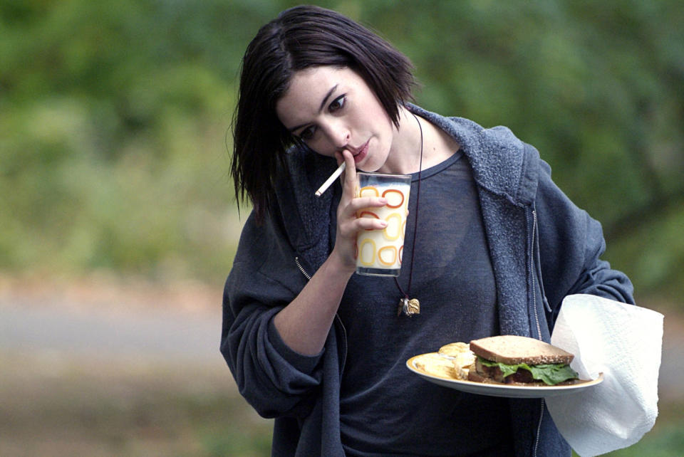 Anne Hathaway smoking.