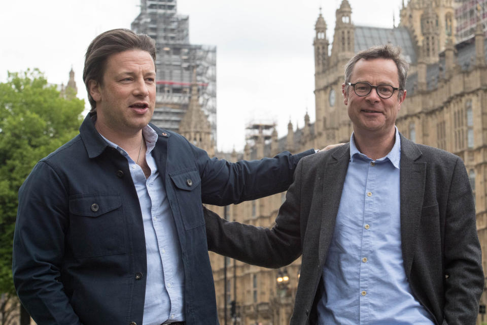 Jamie Oliver (left) and Hugh Fearnley-Whittingstall on College Green, London, after giving evidence to the Health and Social Care Committee about child obesity. (Photo by Stefan Rousseau/PA Images via Getty Images)