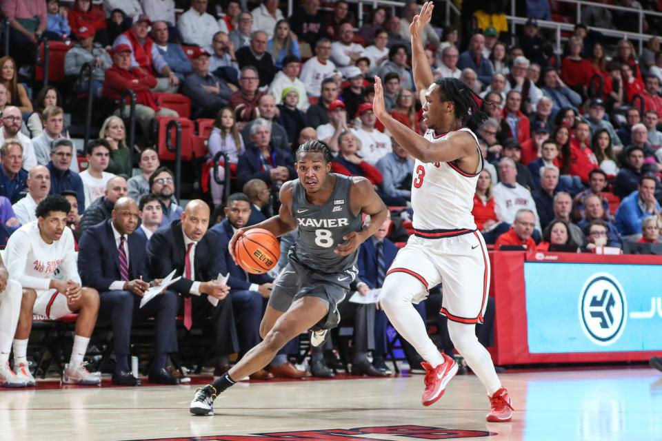 Dec 20, 2023; Queens, New York, USA; Xavier Musketeers guard Quincy Olivari (8) looks to drive past St. John's Red Storm guard Jordan Dingle (3) in the first half at Carnesecca Arena.