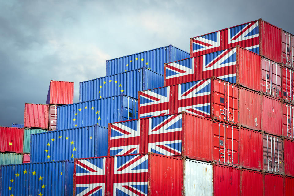 Cargo containers with European Union and British flags 