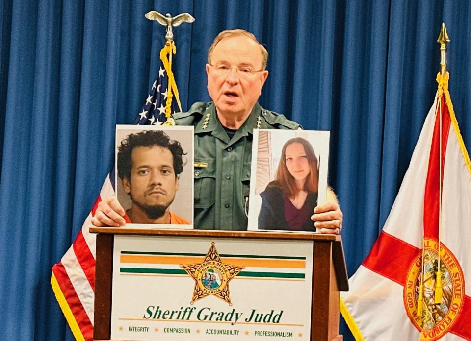 Polk County Sheriff Grady Judd holds up a photo of murder suspect Enrique Martinez, left, and victim Sierra Hernandez, right, during a news conference Monday afternoon. The Sheriff's Office confirmed Sierra Hernandez, 20, was found dead recently.